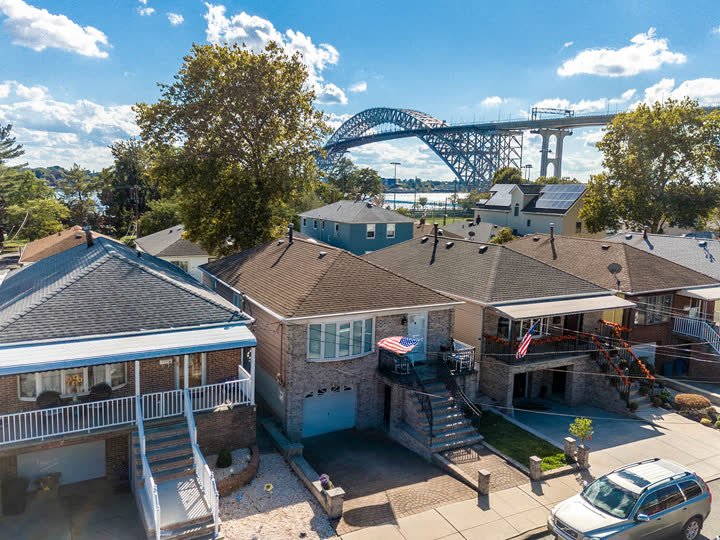 Aerial view of a Bayonne home with the Bayonne Bridge beyond